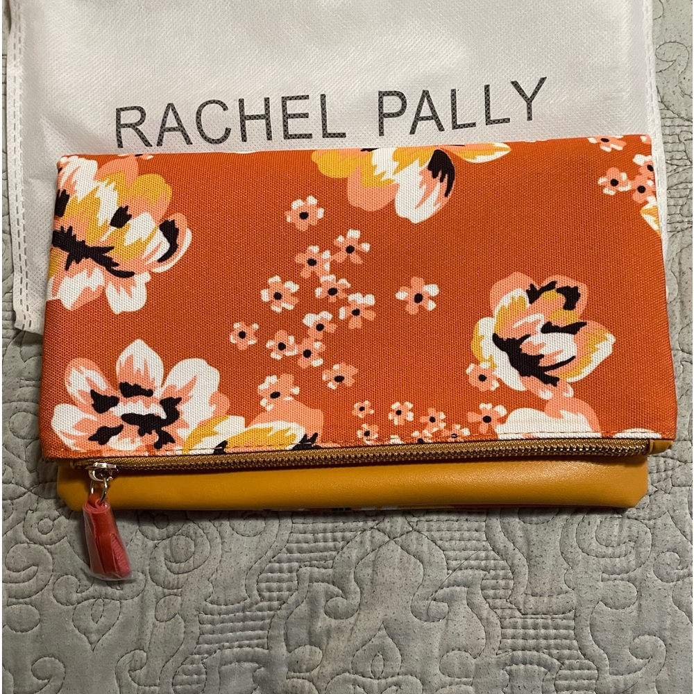 Rachel Pally NWOT clutch in orange, yellow, and white floral print.